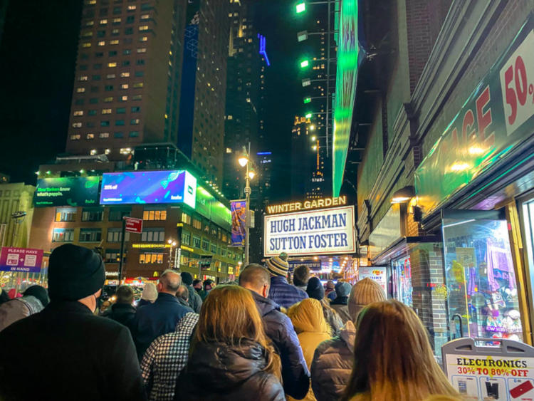 people in line for a Broadway show wearing jackets