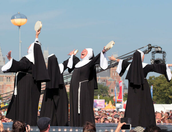 Four women dressed as nuns singing in a musical